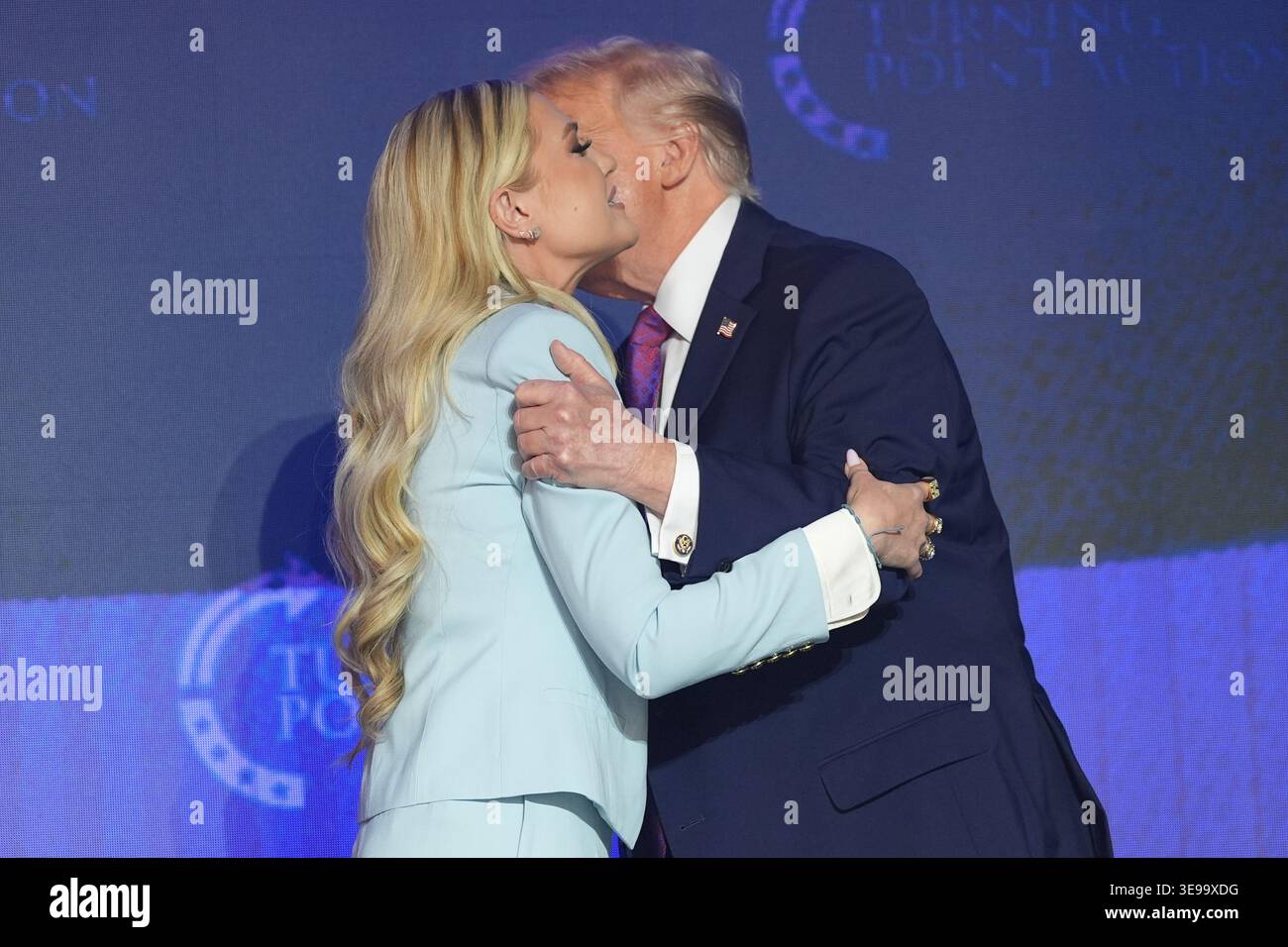 President Donald Trump greets Erika Kirk at a Turning Point USA event ...