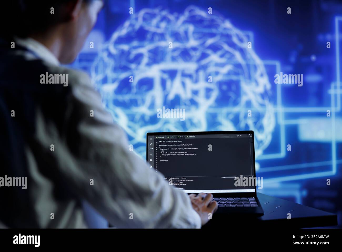 Admin writes code on laptop to visualize artificial intelligence neural networks made up of interconnected nodes using augmented reality technology. Expert running AI script for data processing Stock Photo