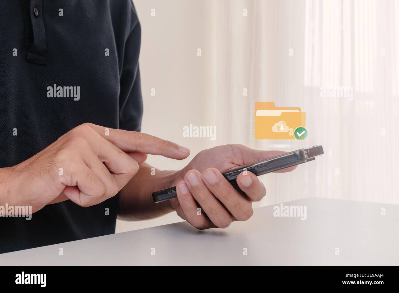 A man holding a smartphone with digital folder icon for document management and cloud storage Stock Photo