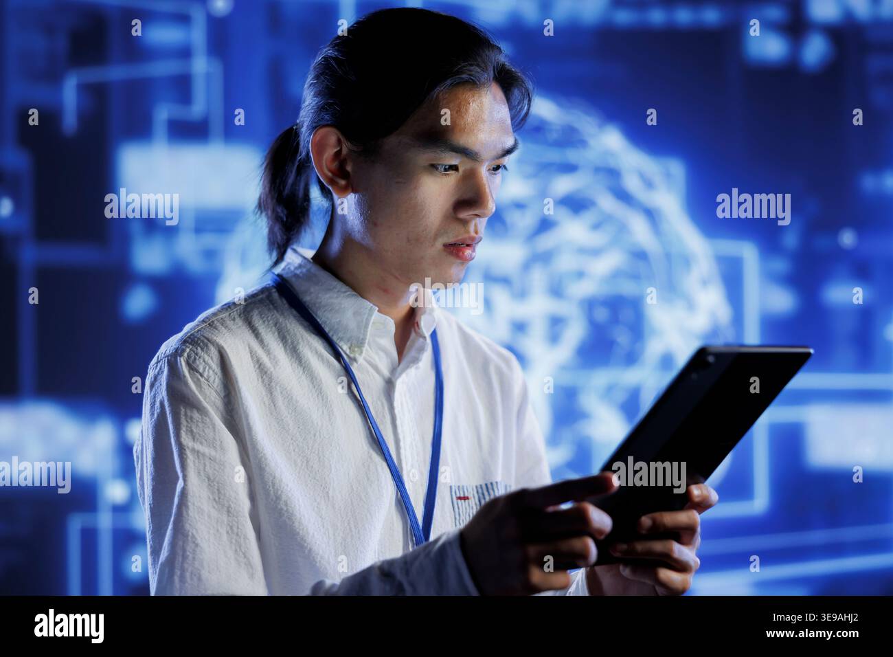 Computer scientist using tablet to maintenance artificial intelligence neural networks simulating human thought processes in computerized model. Tech support doing checkup on AI systems Stock Photo