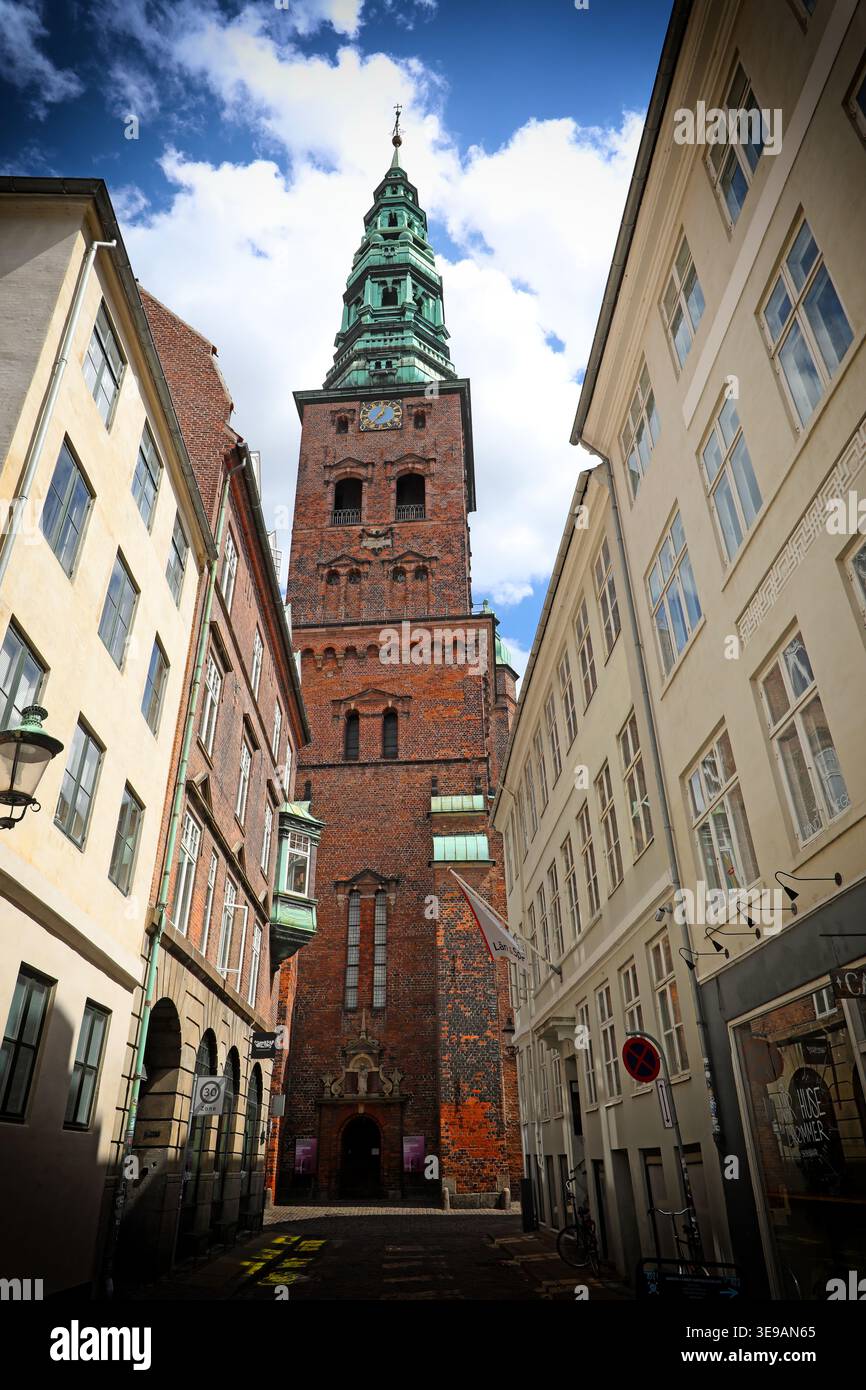 tower of Nikolaj Kunsthal, the former St Nicholas Church in central Copenhagen. It sits on Nikolaj Plads.jp, Copenhagen, Denmark. Stock Photo