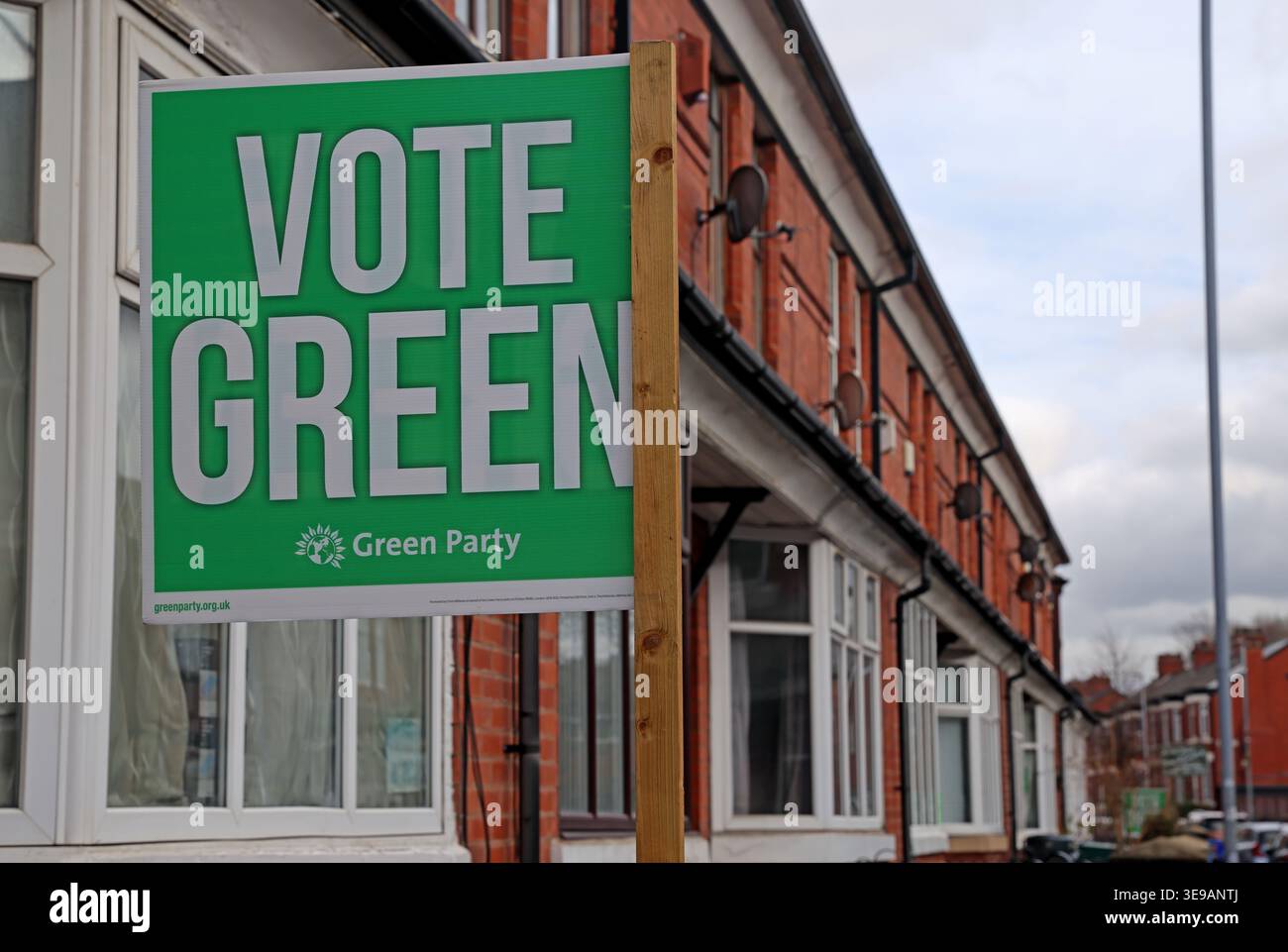 Vote Green sign for Sarah Wakefield in a traditional British terraced street with red-brick houses, Ashton In Makerfield by-election June 2026 Stock Photo