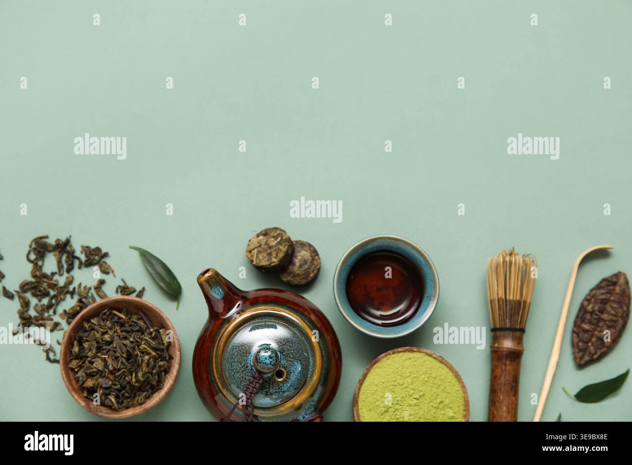 Composition with matcha tea and accessories on olive background Stock Photo