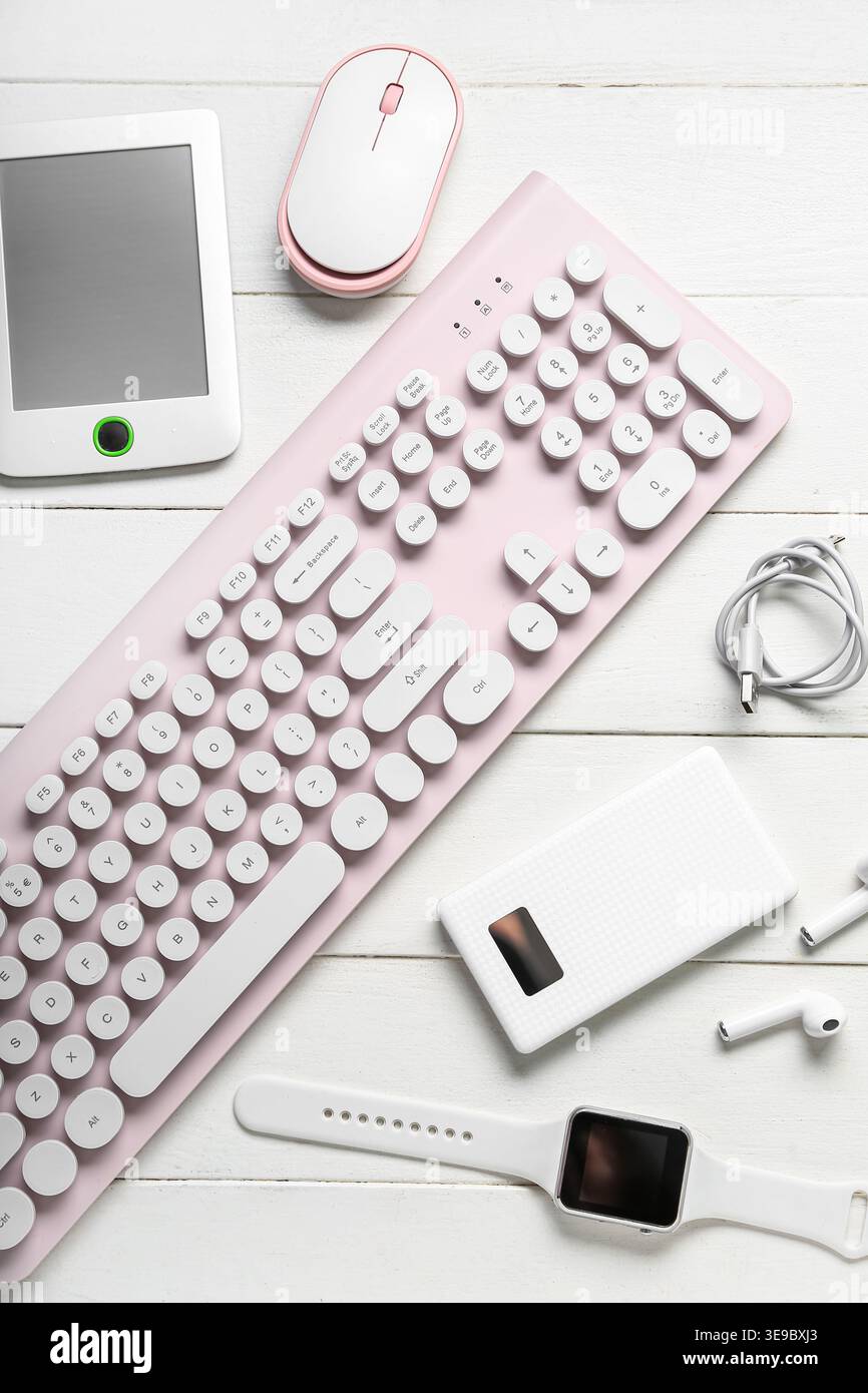 Composition with different modern gadgets on white wooden background Stock Photo