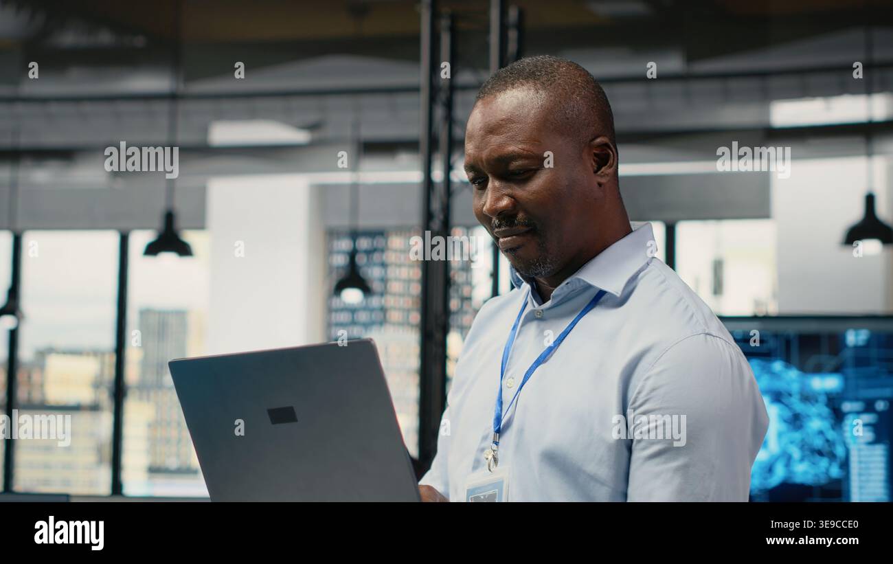 Engineers in office doing software development to launch new features. Startup company IT workers writing computer programs, doing code testing and quality assurance, camera B Stock Photo