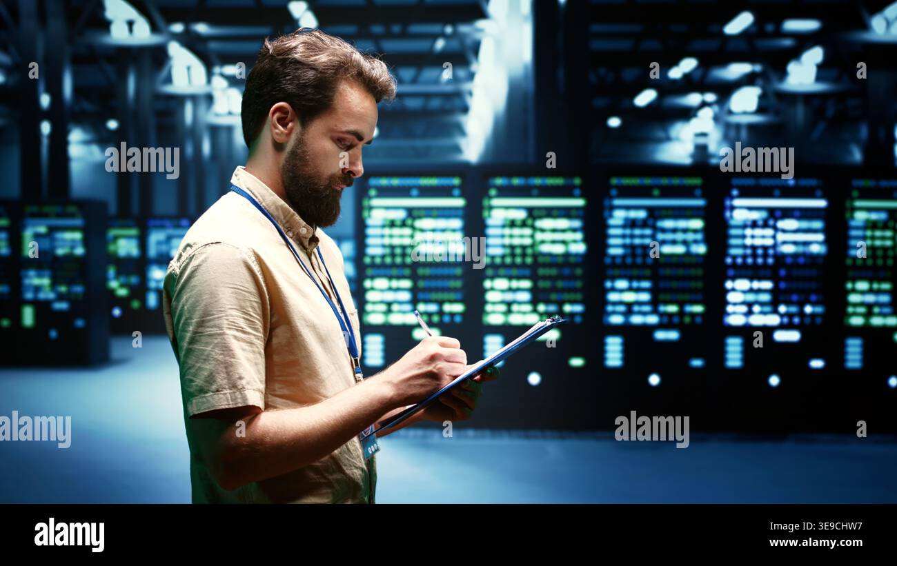 Experienced system administrator maintenancing interlinked computers creating server network. Data storage service business using parallel computing to perform complex calculations Stock Photo