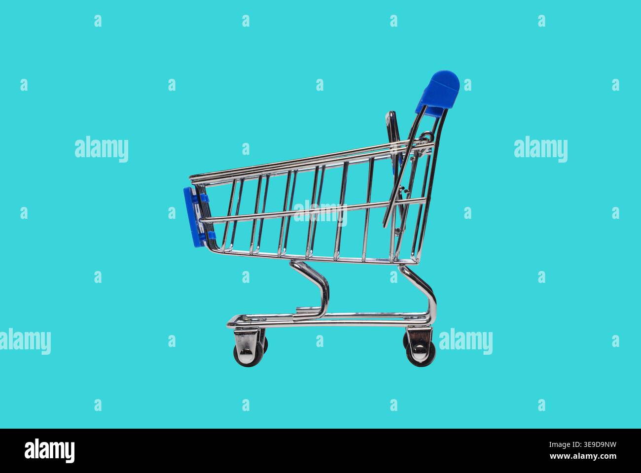 Shopping cart on blue background Stock Photo