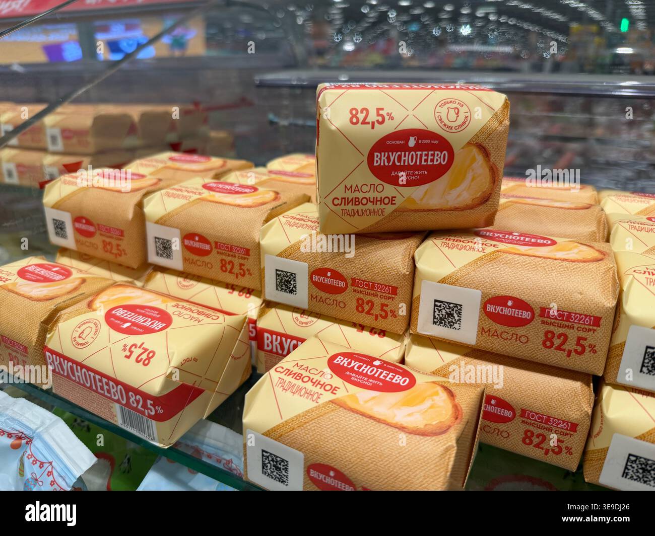 Moscow, Russia - April 01, 2026: Packaged butter blocks labeled stacked ...
