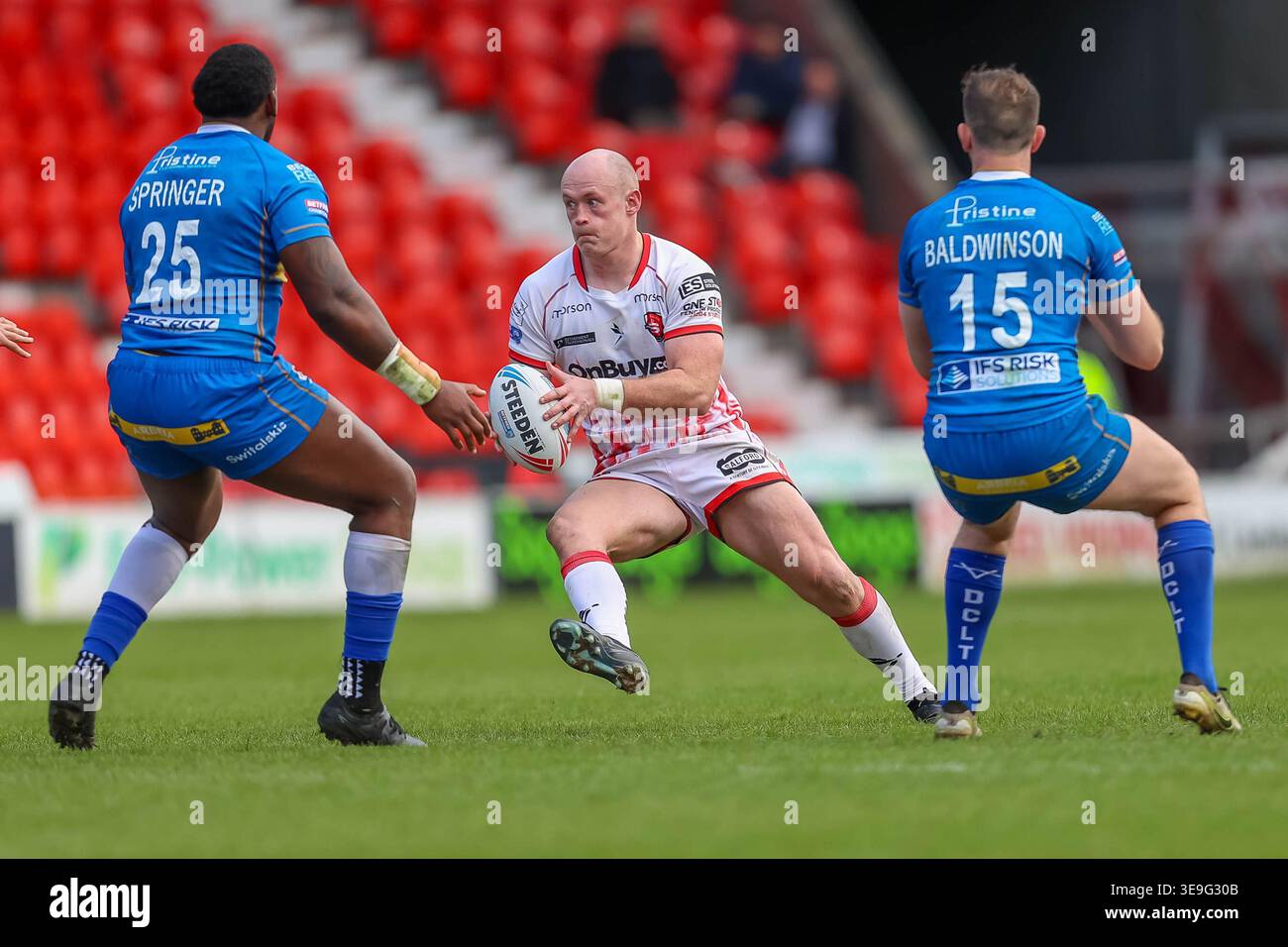 Jack Bibby runs at Gadwin Springer and Jordan Baldwinson during the ...