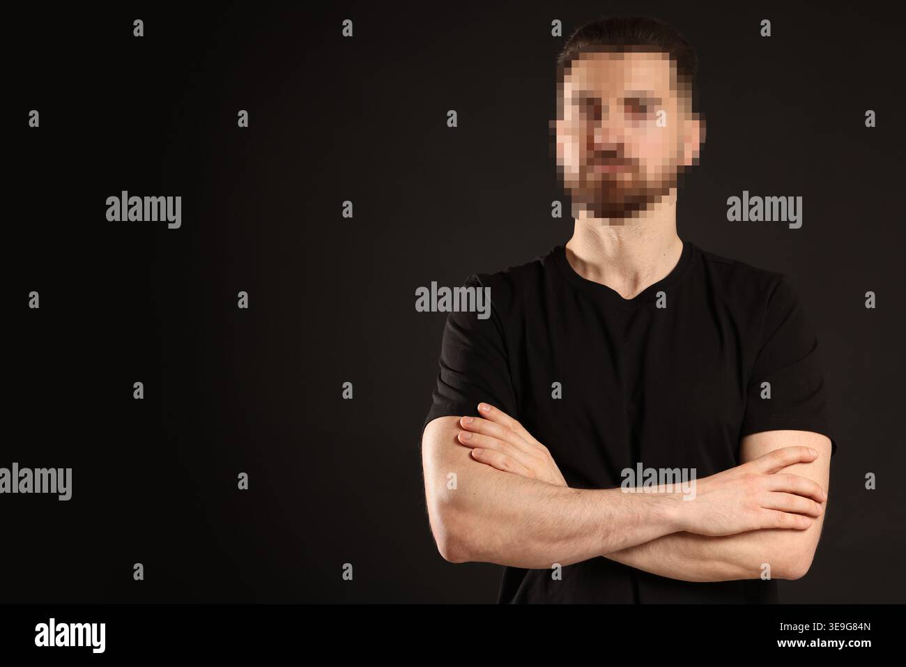 Anonymous man with pixelated face on black background Stock Photo