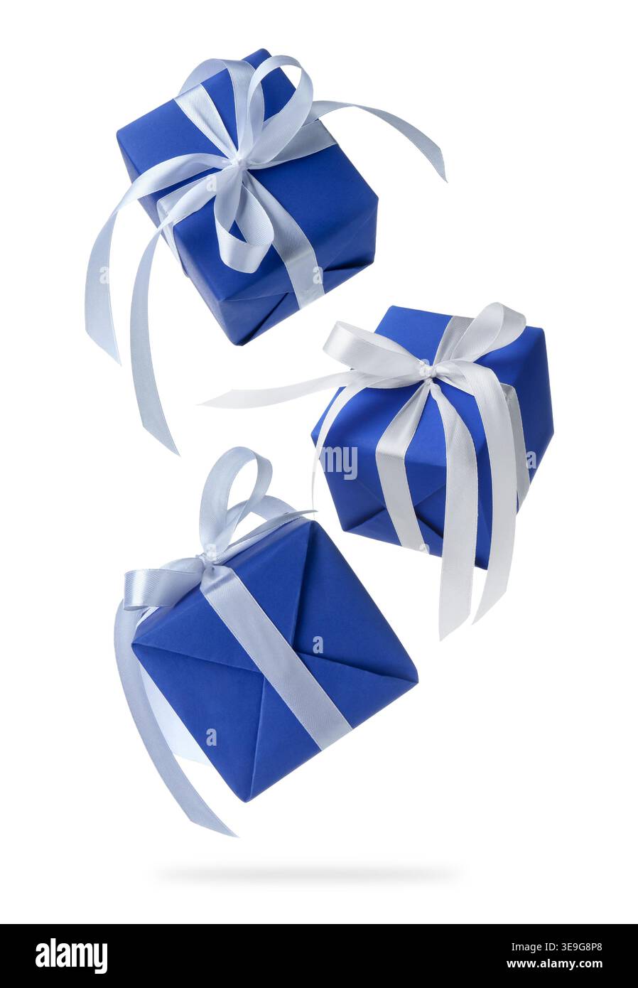 Gift boxes flying in air against white background Stock Photo