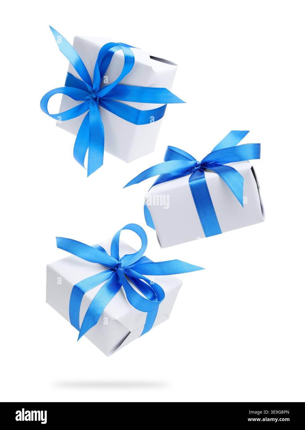 Gift boxes flying in air against white background Stock Photo