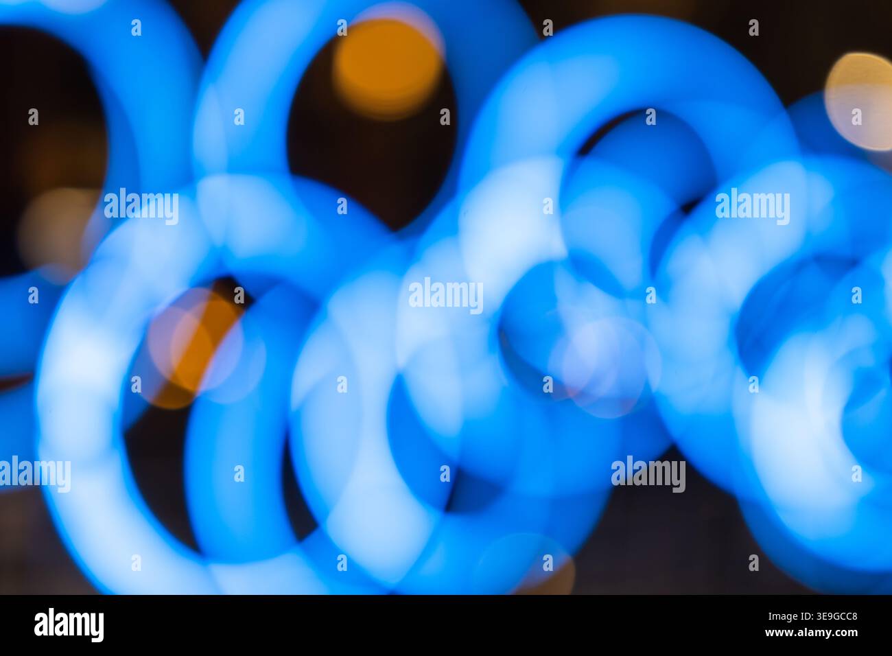 Blurred blue circular lights creating a bokeh effect Stock Photo