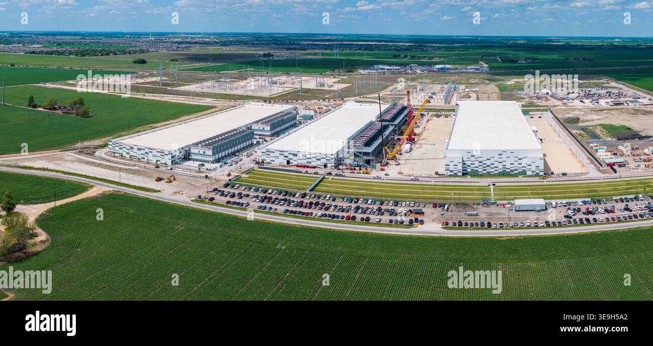 Aerial view of the construction of a massive AI data center campus with ...
