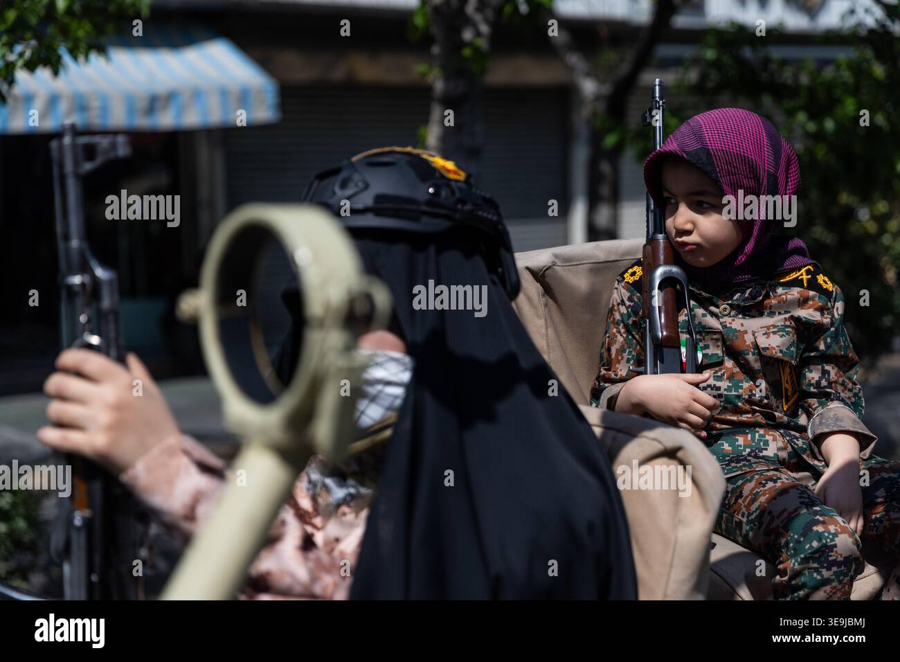 A young girl member of the Basij paramilitary, affiliated with Iran's ...