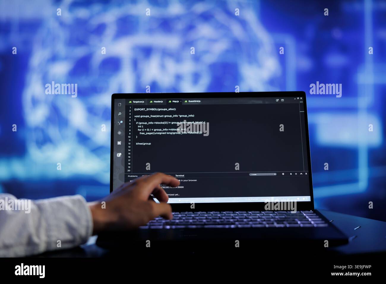 Admin writes code on laptop to visualize artificial intelligence neural networks using augmented reality technology, close up. Expert running AI script for data processing, blurry background Stock Photo