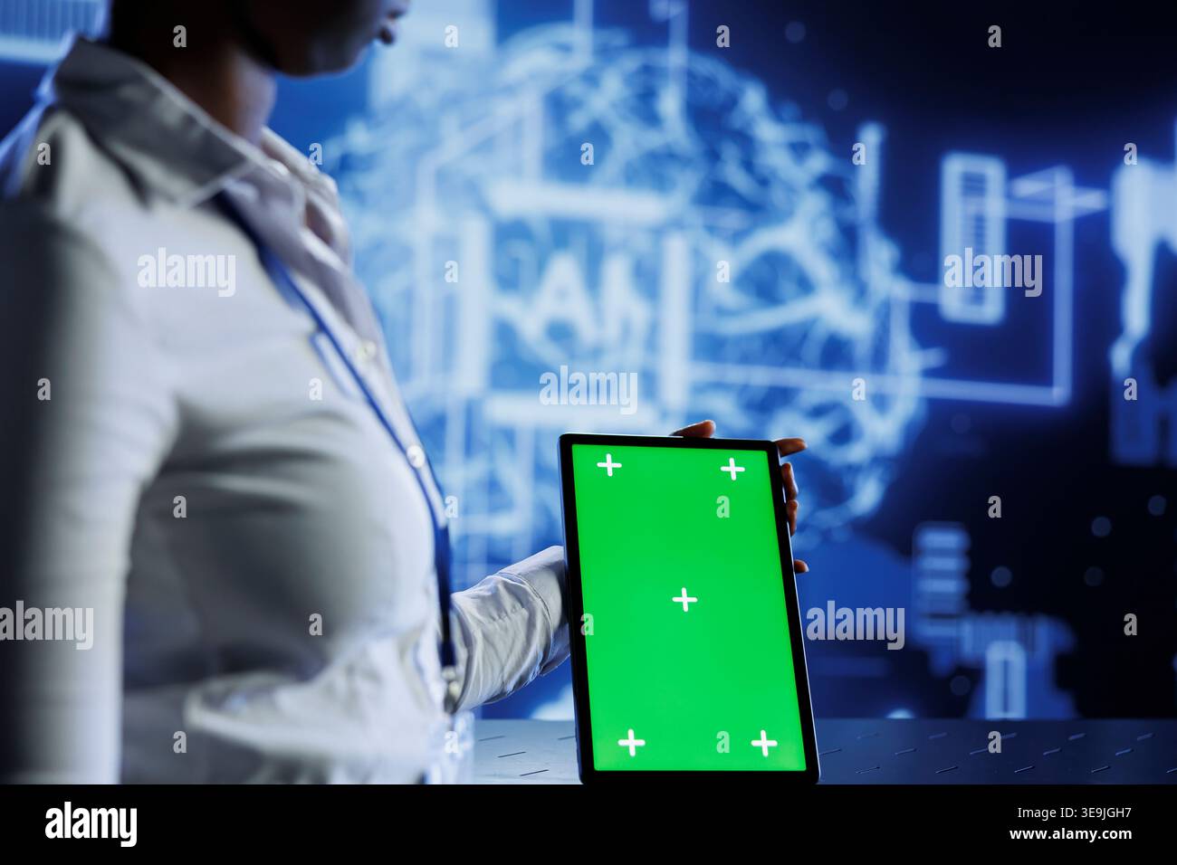 Experienced developer uses mockup tablet to update neural networks, writing intricate binary code scripts on tablet. Worker uses isolated screen device programming to upgrade AI simulation model Stock Photo