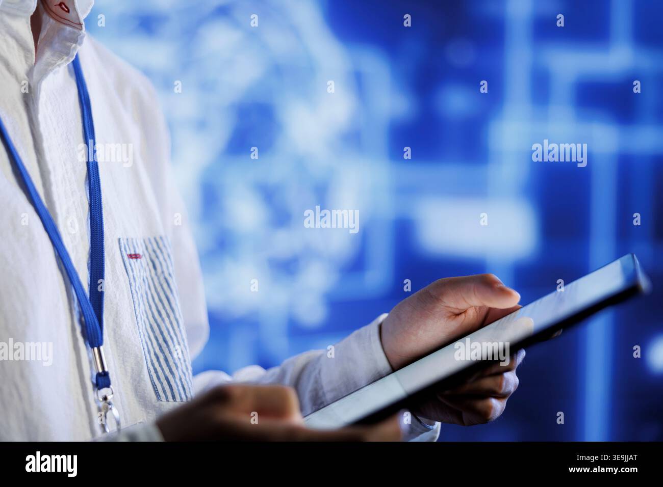 Computer scientist writes code on tablet to visualize artificial intelligence neural networks using augmented reality, close up. Server room professional runs AI script for information processing Stock Photo