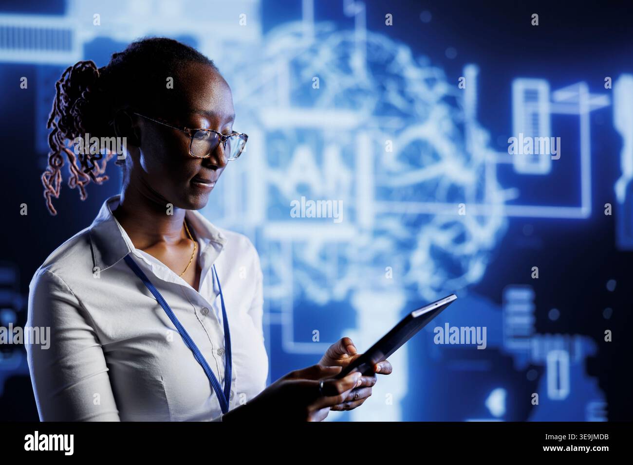 African american admin writes code on tablet to visualize artificial intelligence neural networks using augmented reality. High tech workspace supervisor runs AI script for information processing Stock Photo