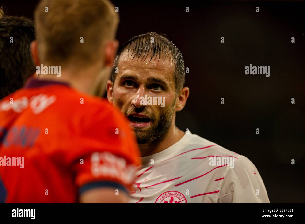 Melbourne City player Andreas Kuen (R) faces Brisbane Roar player Matt ...