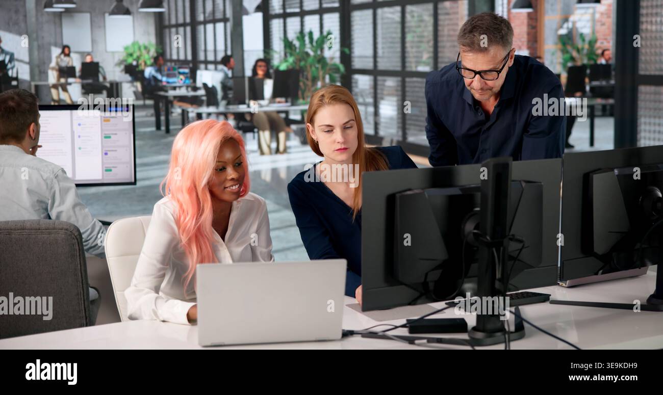 Manager Leads Diverse Team Training On Secure Document Management System. Stock Photo