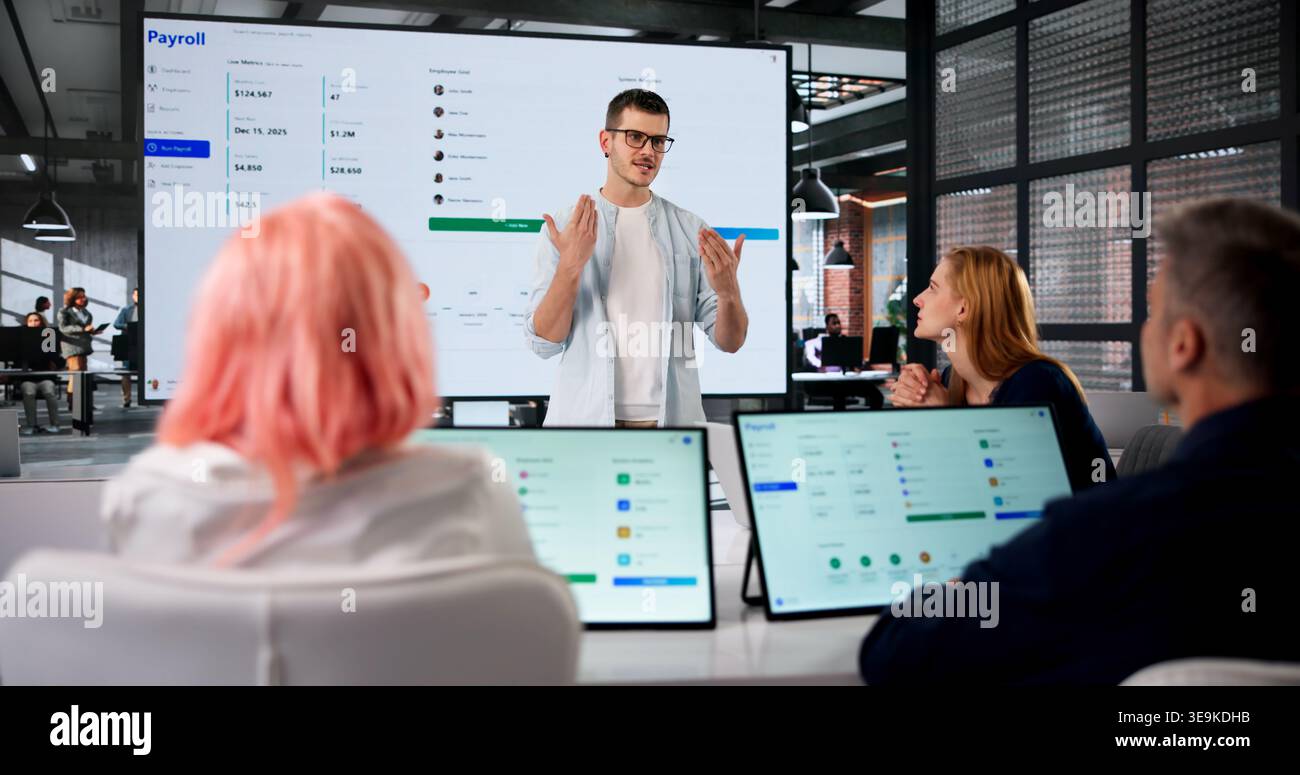 Human Resources Manager Leads Team Meeting Explaining Payroll Software Integration Process. Stock Photo