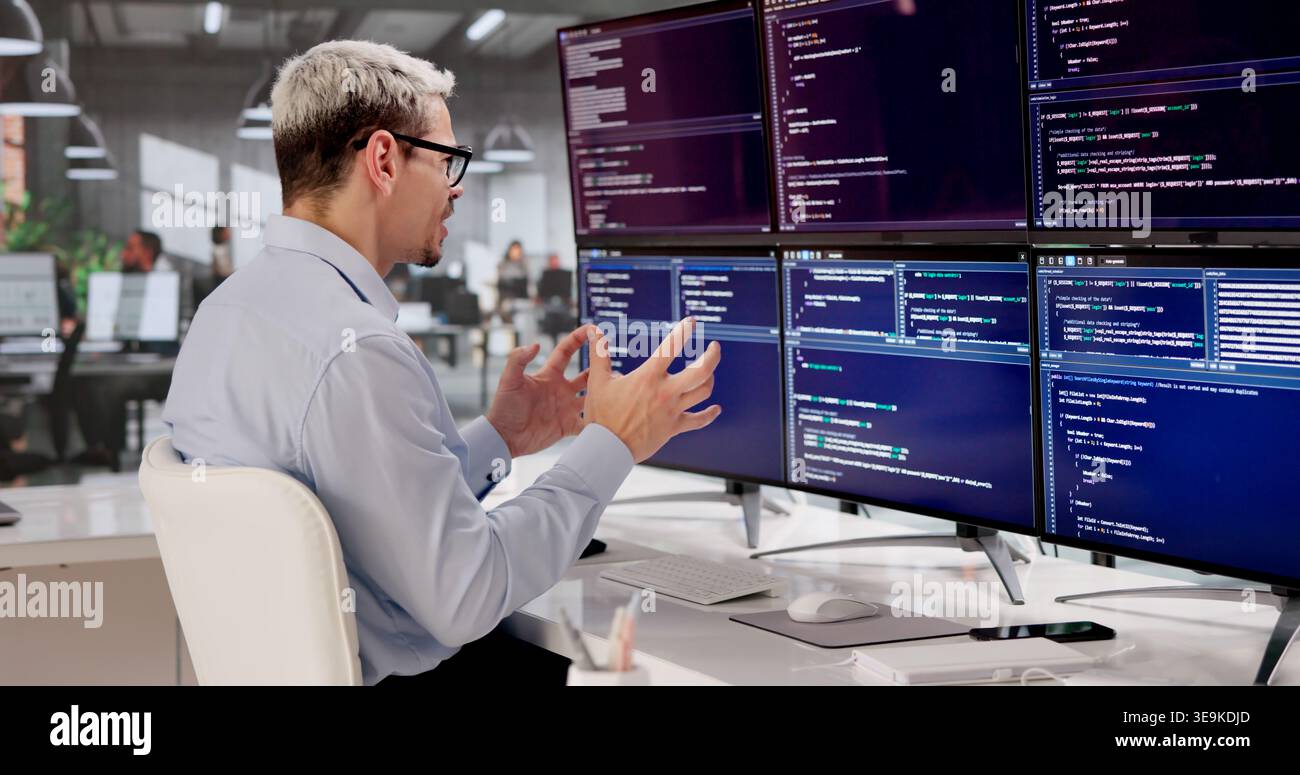 Frustrated Programmer Struggling With Complex Web Development At Office Desk Stock Photo