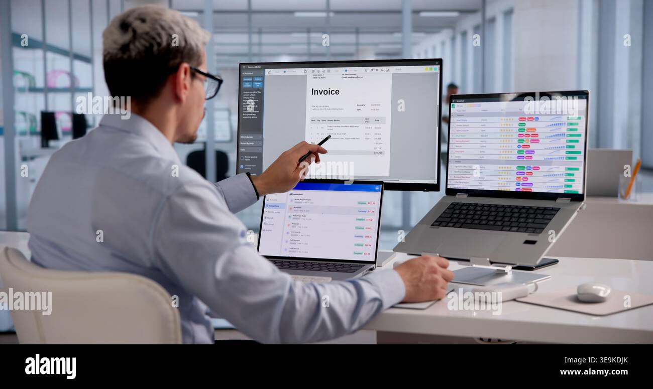 Accountant examining digital invoice hi-res stock photography and ...