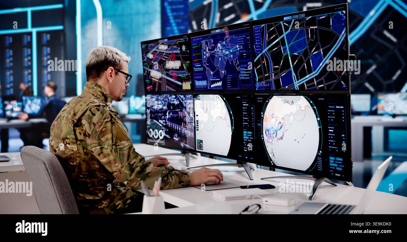 Army Officer Overseeing Several Computer Displays In A High-Tech ...