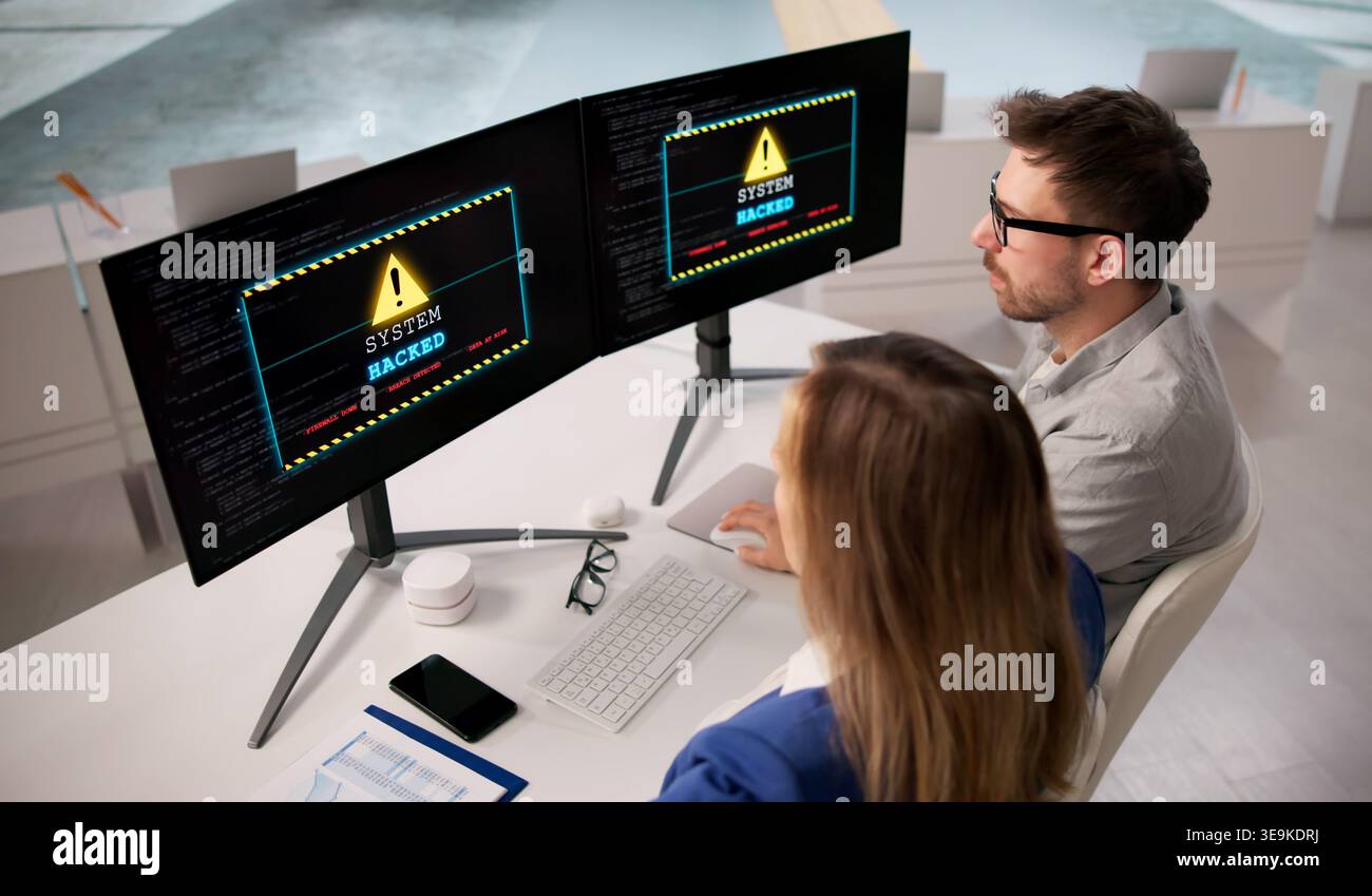 Ransomware Threat Strikes Business Computers. Cybersecurity Risks And Data Breach Concerns Stock Photo