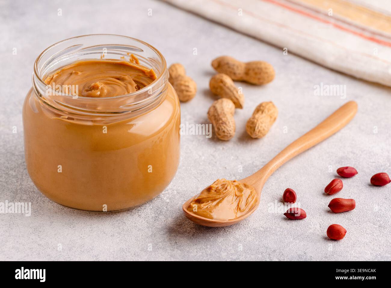 Peanut paste in an open jar Stock Photo