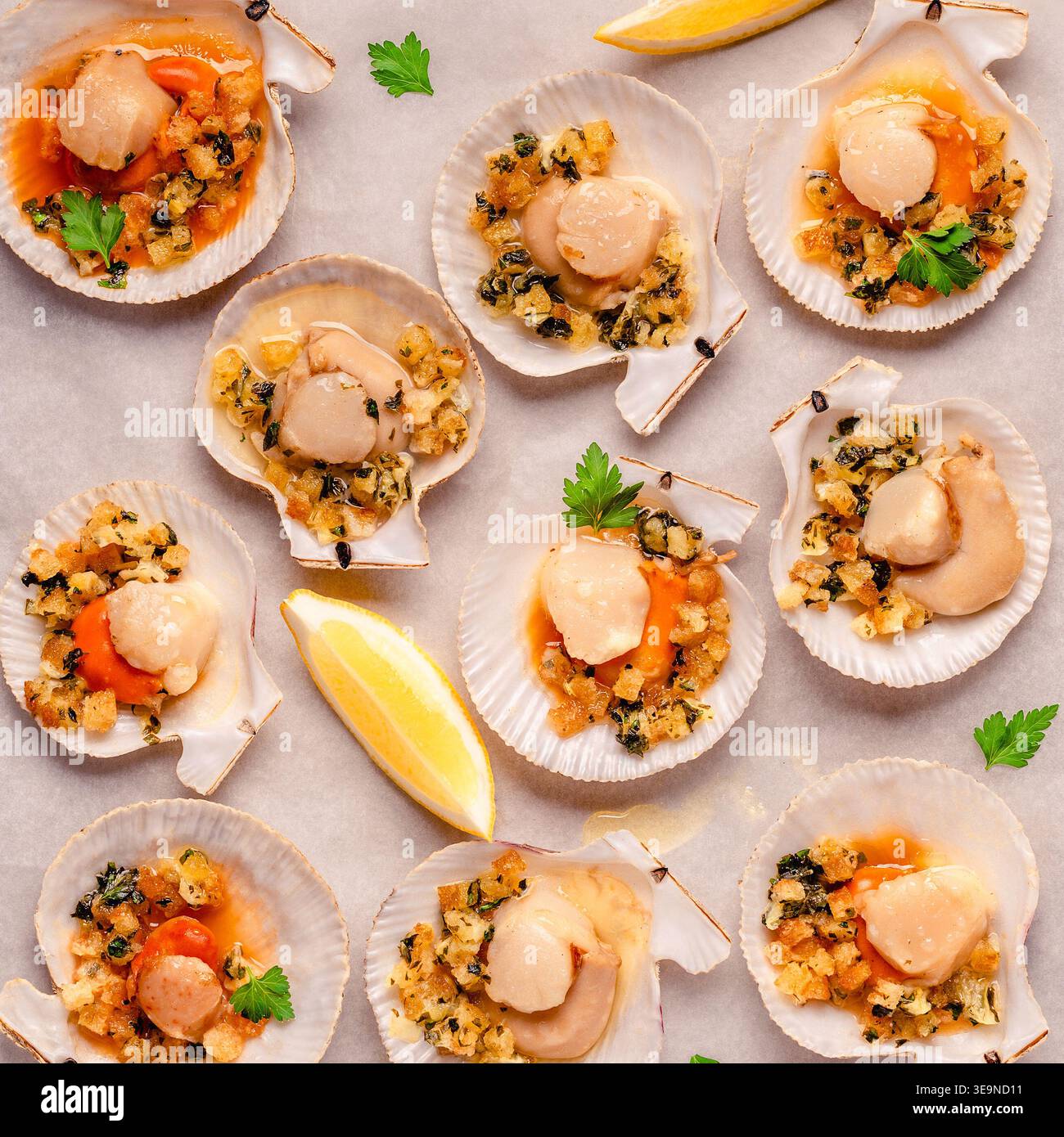 Cooked scallops with sauce on a baking sheet Stock Photo
