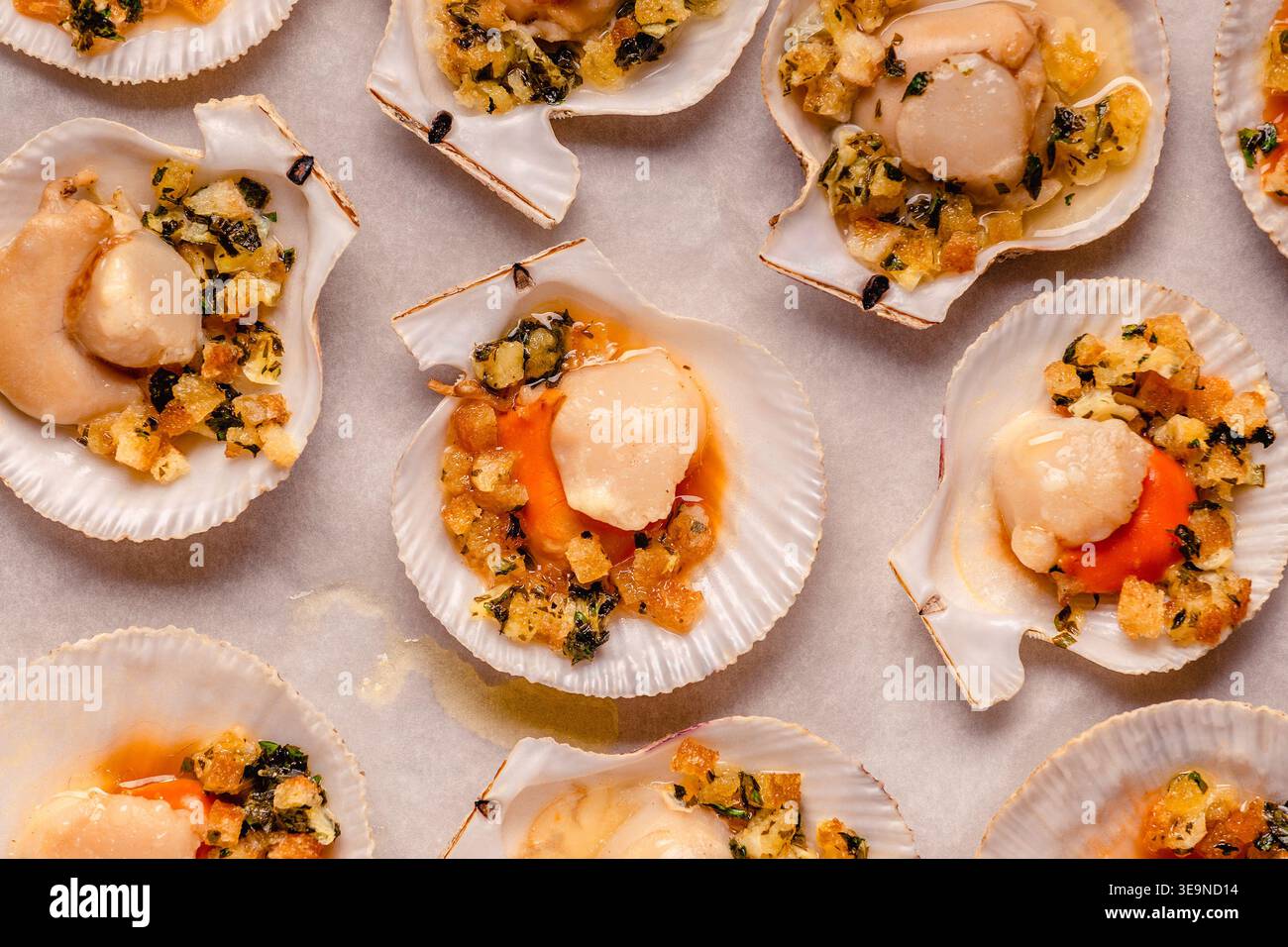 Cooked scallops with sauce on a baking sheet Stock Photo