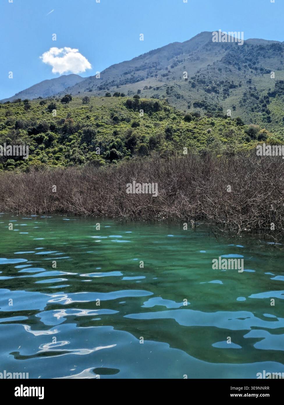 Blue green calm lake surrounded by green hills at Lake Kournas Crete Stock Photo