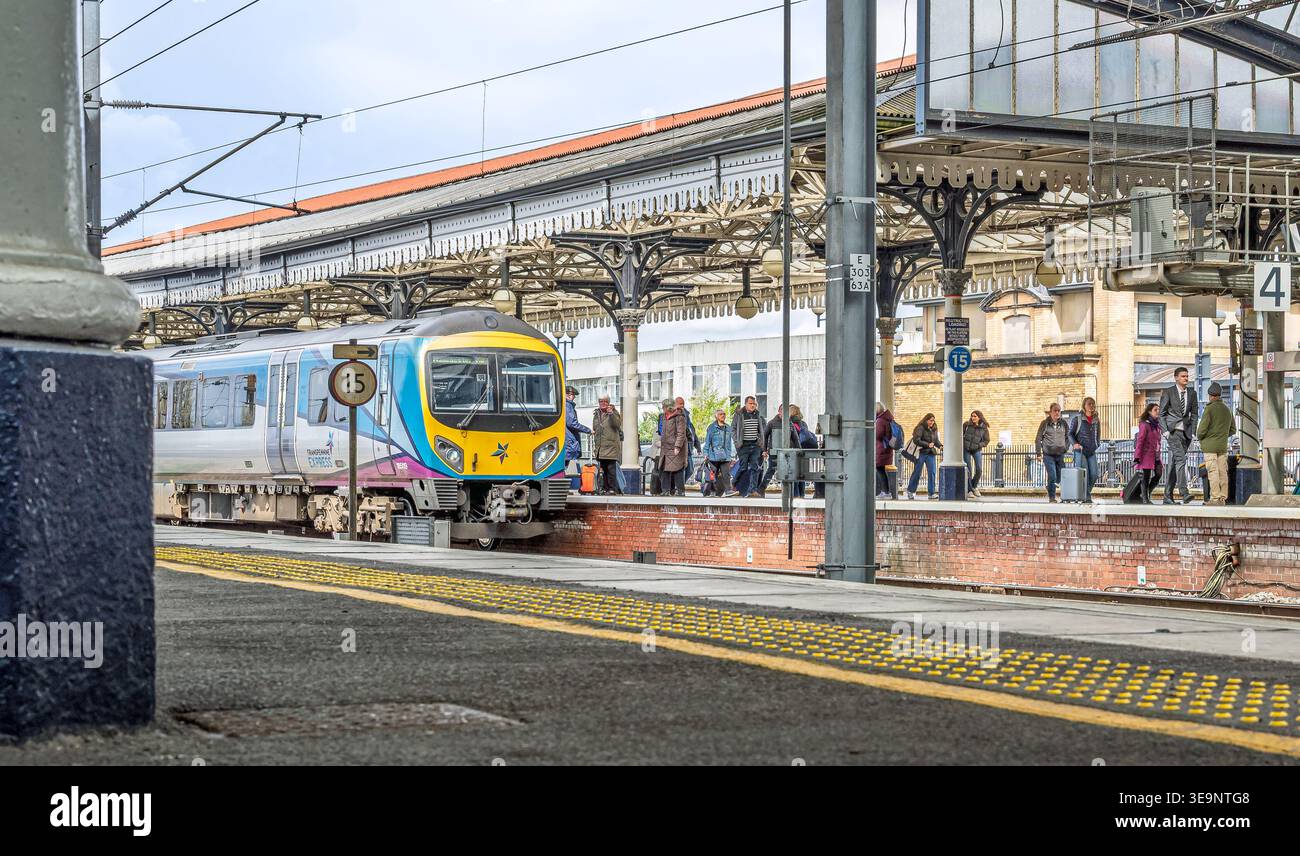 Train Columm A train has just arrived at a railway station platform and passengers ...
