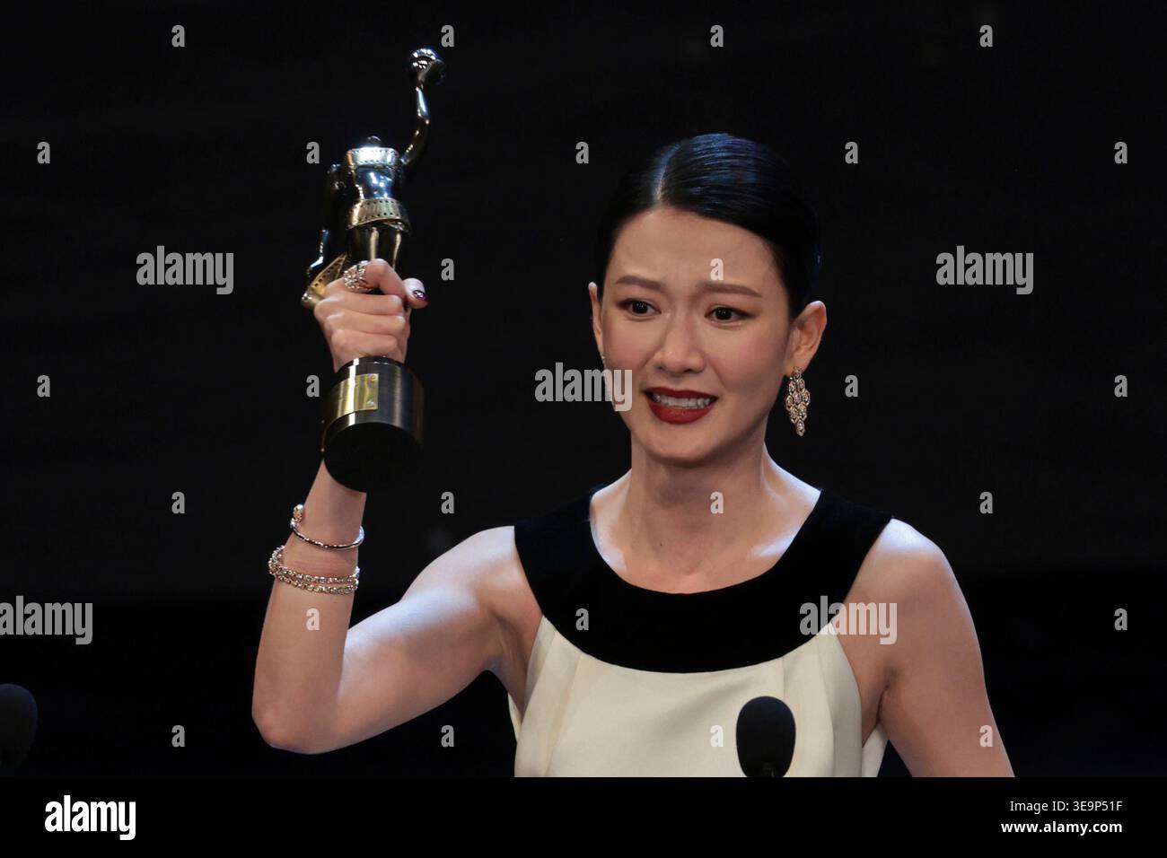 Fish Liew, center, reacts after receiving the Best Actress award for ...