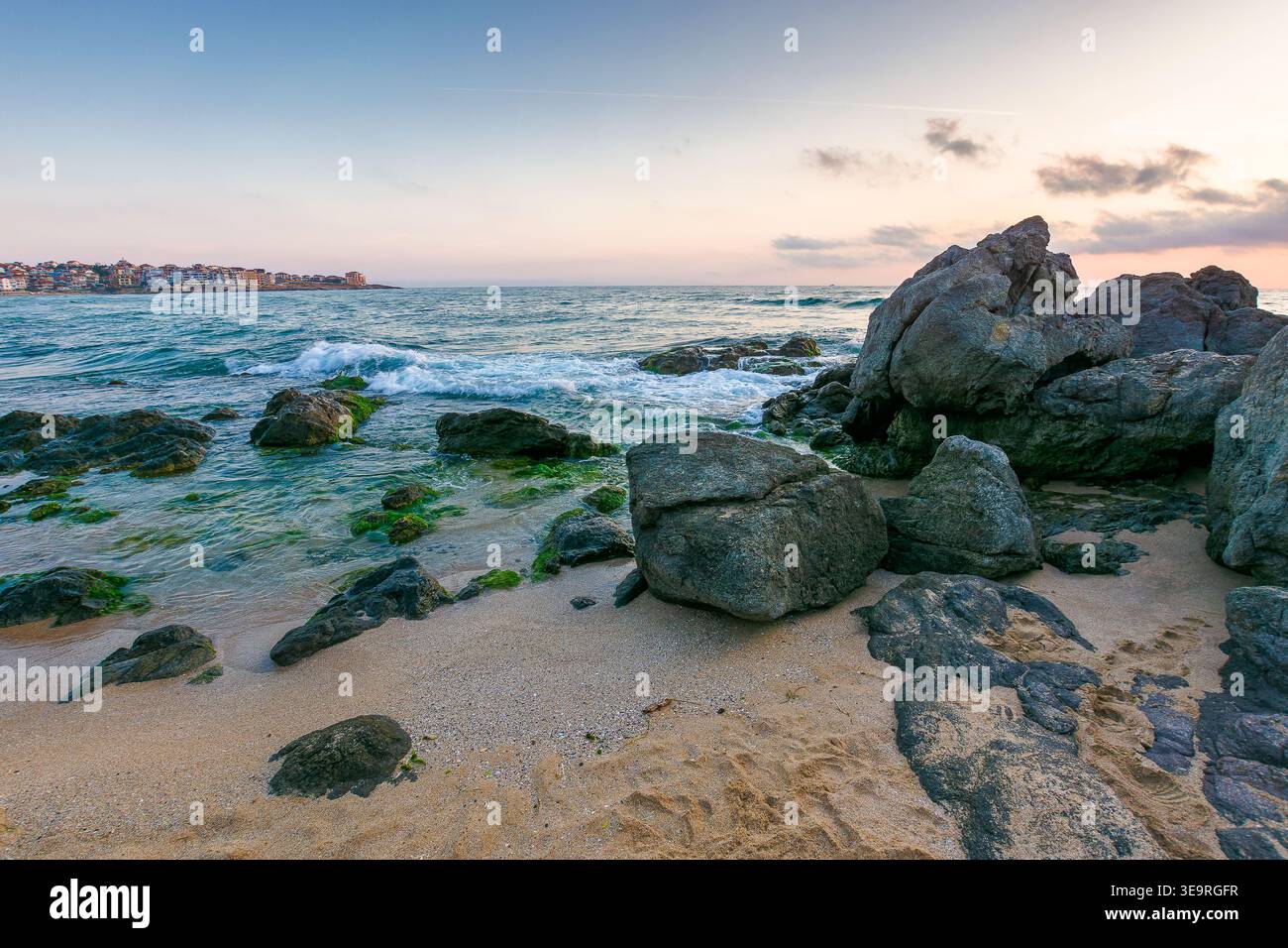 sunrise over sandy beach landscape. coastal seascape scenery of southern bulgaria, sozopol. nature background for summer vacation at the shore of blac Stock Photo