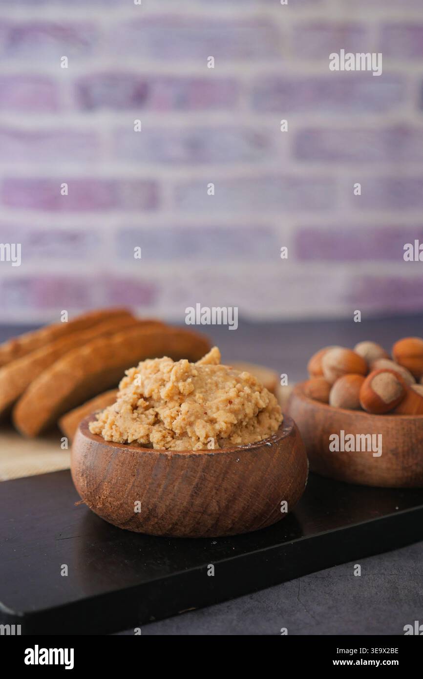 hazelnut spread and nuts on a table  Stock Photo