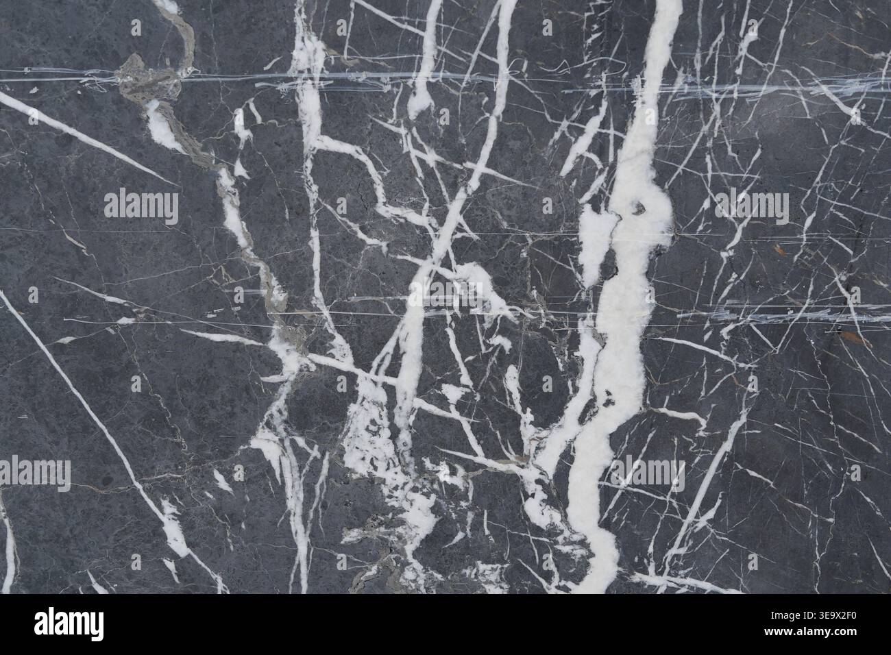 Marble stone with white veins on dark surface Stock Photo