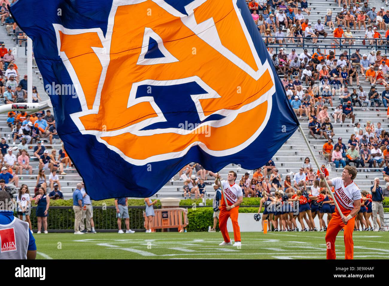 Auburn University flag runners on Pat Dye Field at Auburn's A-Day spring scrimmage football game at Jordan-Hare Stadium in Auburn, Alabama. (USA) Stock Photo