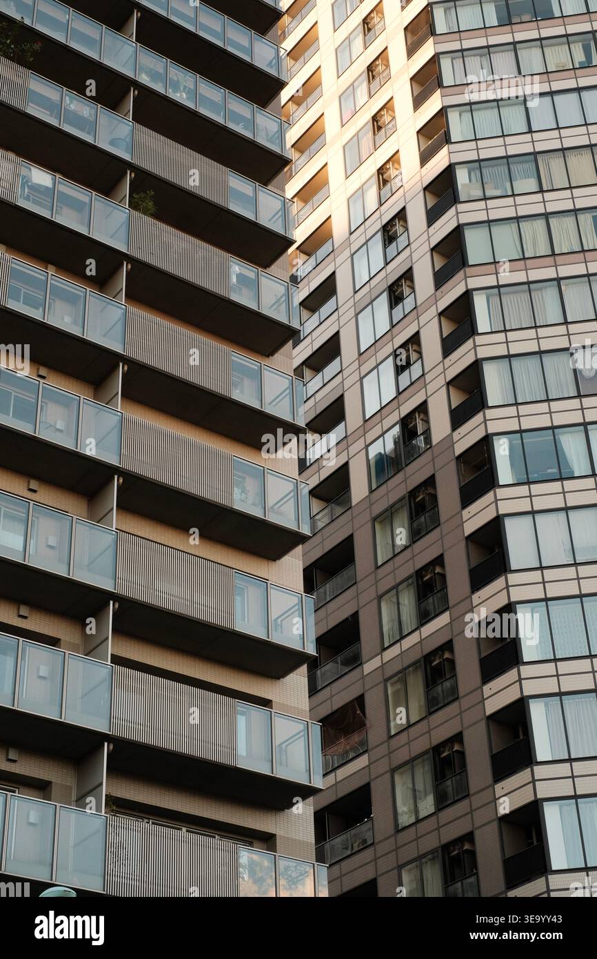 Angled view of modern residential buildings with balconies and glass ...