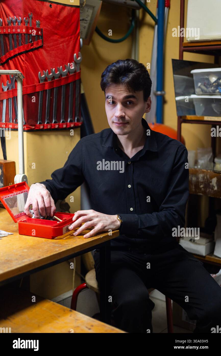 Portrait of a young technician working at a workshop bench Stock Photo