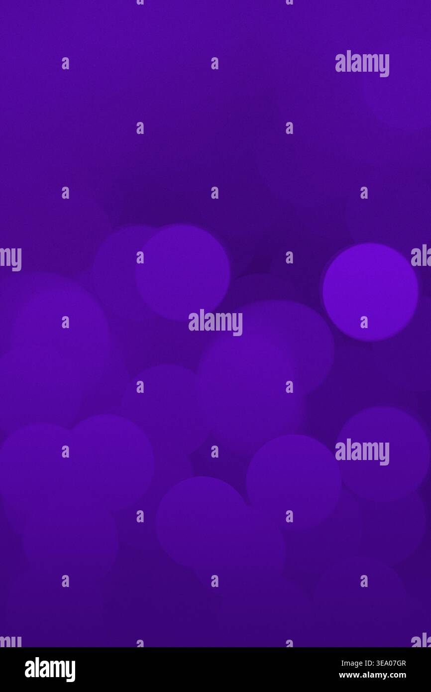 Vertical abstract purple bokeh texture with soft glowing circles, dark ...