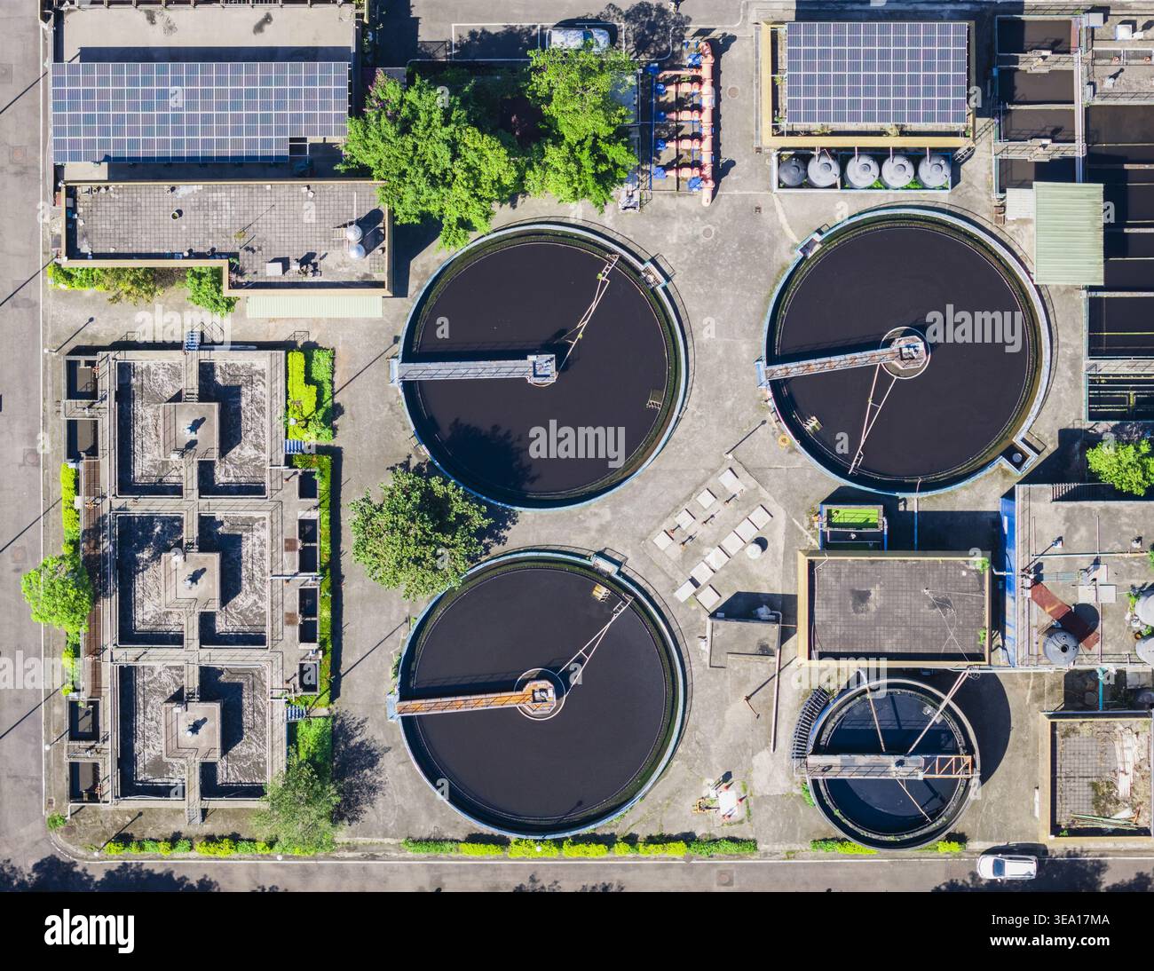 Rectangular Calrifiers Aerial view of a wastewater treatment plant featuring circular ...