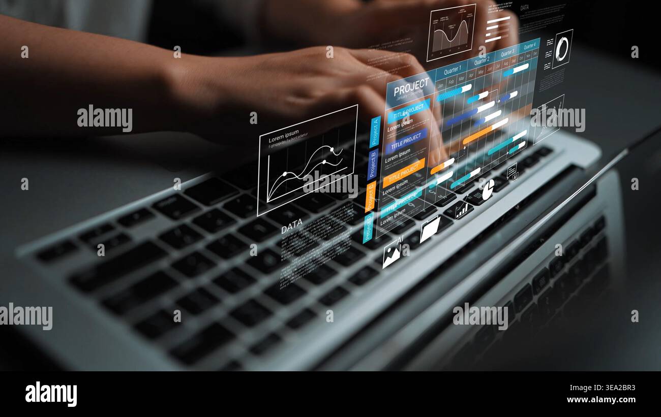 Close-up of hands typing on a laptop keyboard with digital holographic interface displaying graphs and data analytics, representing modern technology Stock Photo