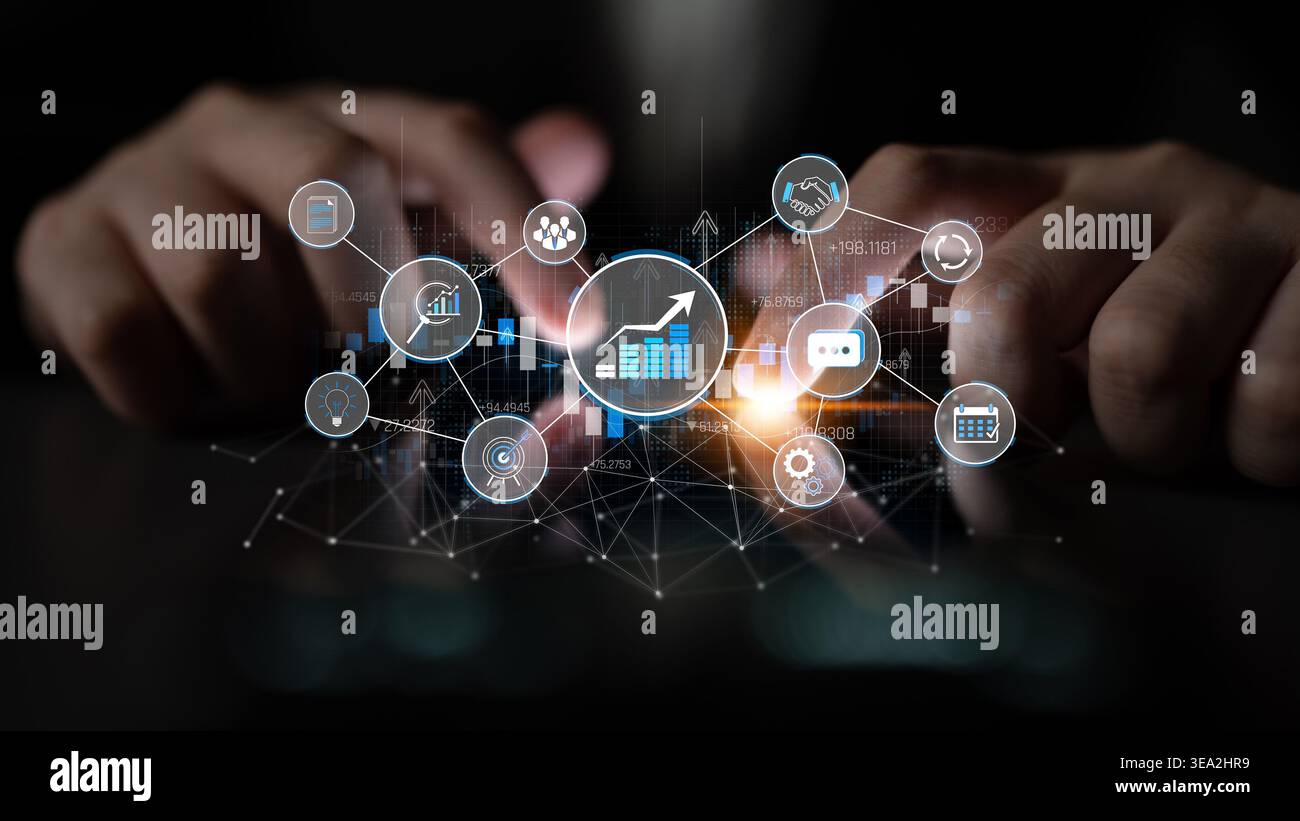 Hands Typing on a Keyboard with Digital Financial Growth Icons and Data Visualization Elements Representing Business Success and Innovation Strategies Stock Photo