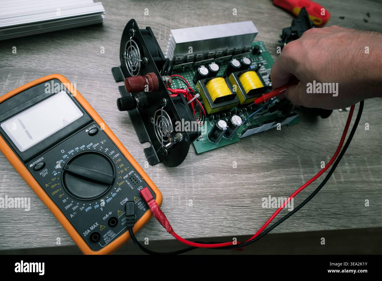 Repair of electronic equipment. Repair of Car power inverter dc to ac. Transistors with a radiator in the inverter Stock Photo