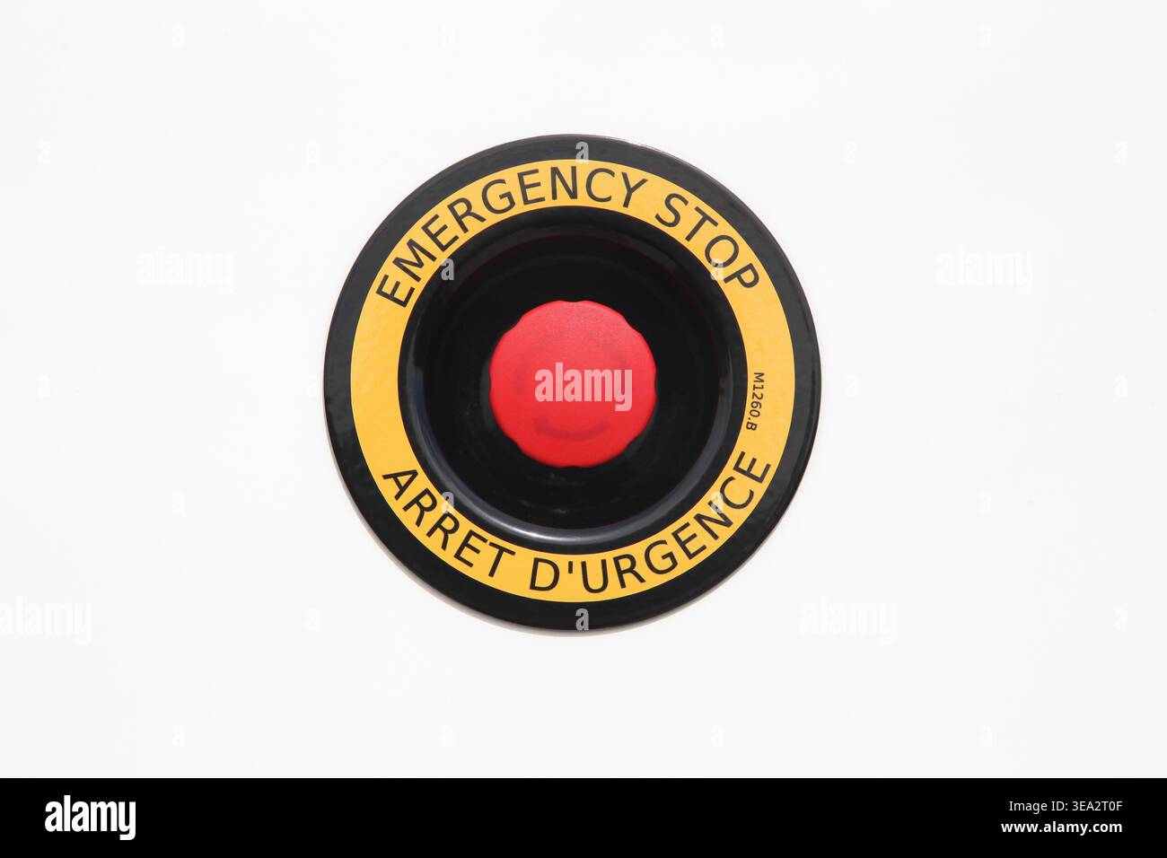 Emergency stop button on a wall Stock Photo