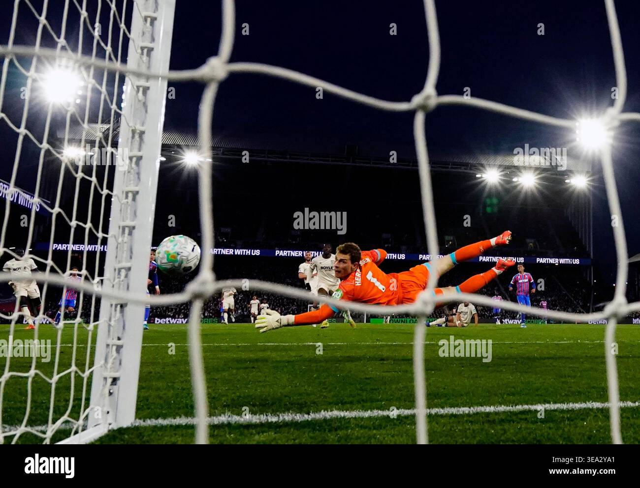 West Ham United goalkeeper Mads Hermansen makes a save during the ...