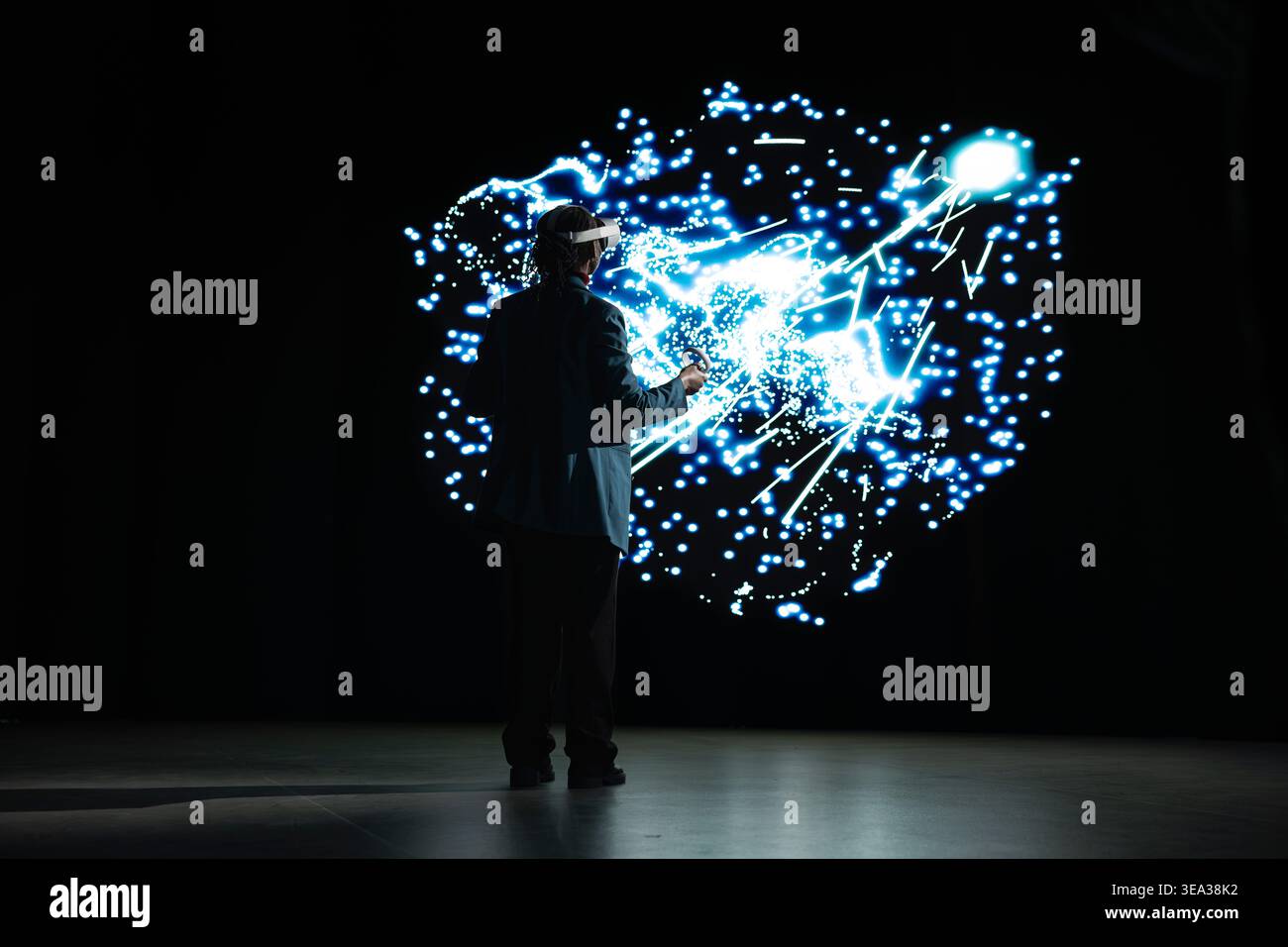 Programmer monitoring AI cognitive systems using VR headset gear. IT specialist using virtual reality AR simulation to study neural network nodes activity and understand data processing algorithms Stock Photo